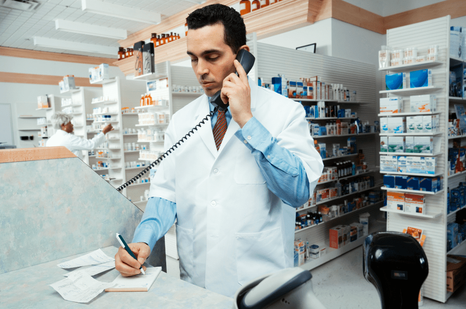 Pharmacist using a phone